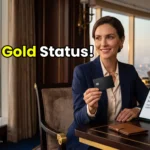 High-net-worth individual activating a Jumeirah One Gold status match utilizing a premium UAE bank reward credit card inside a Dubai luxury suite.